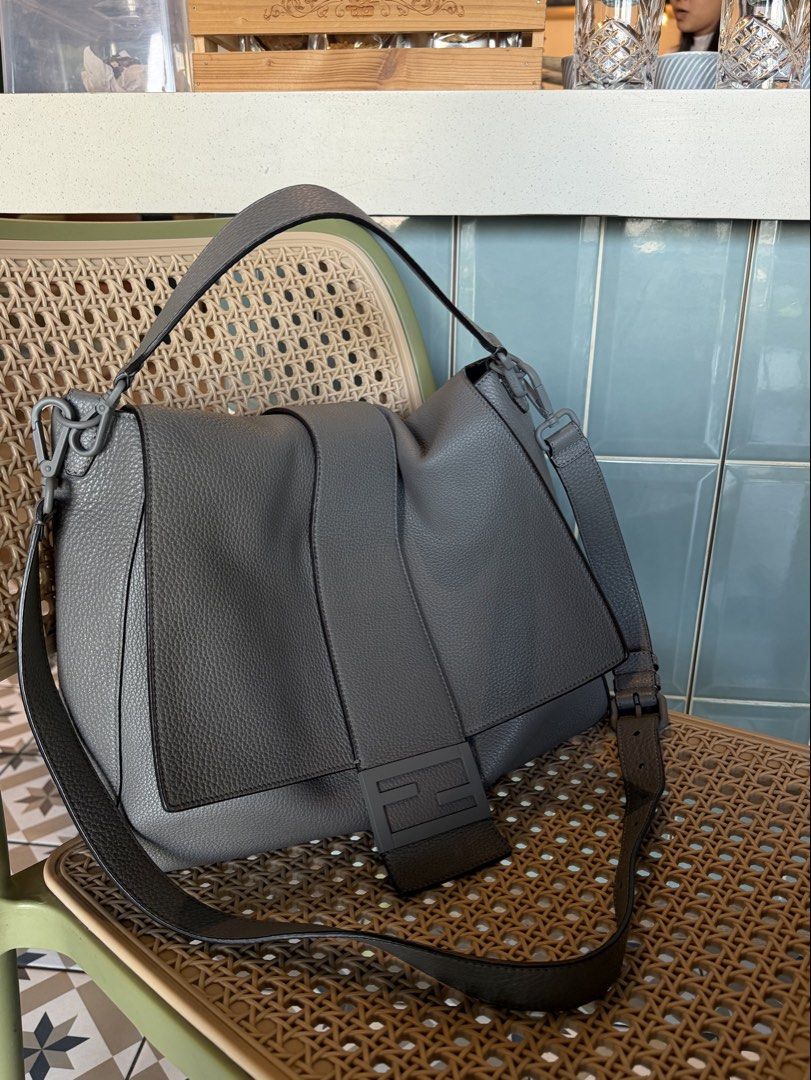 Fendi Baguette Messenger Bag (Category: Luxury Bags & Wallets) located in Davao. Submitted by goodstuff.149 (Listing ID 1462772719, Image 1). Description: Fendi Baguette Messenger Bag Gray Grained Leather Silver-Tone Hardware Flat Handle & Single Adjustable Shoulder Strap Single Exterior Pocket Suede Lining & Dual Interior Pockets Snap Closure at Front Inclusions: Dust bag, cards Condition: Near Unused Purchase History: Bought fr Japan Dimensions