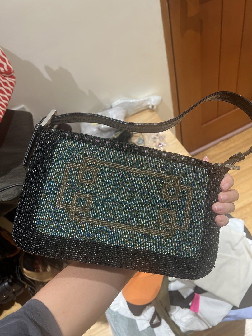 Fendi Beaded Baguette Bag (NGA) (Category: Luxury Bags & Wallets) located in Quezon City. Submitted by iminquezoncity (Listing ID 1462683263, Image 2). Description: - Fendi Baguette Bag - Intricate beadwork with colorful geometric patterns on front - Unique beaded design on back - Black leather strap and trim - Silver Fendi hardware - Magnetic snap closure - Perfect statement piece for your collection.