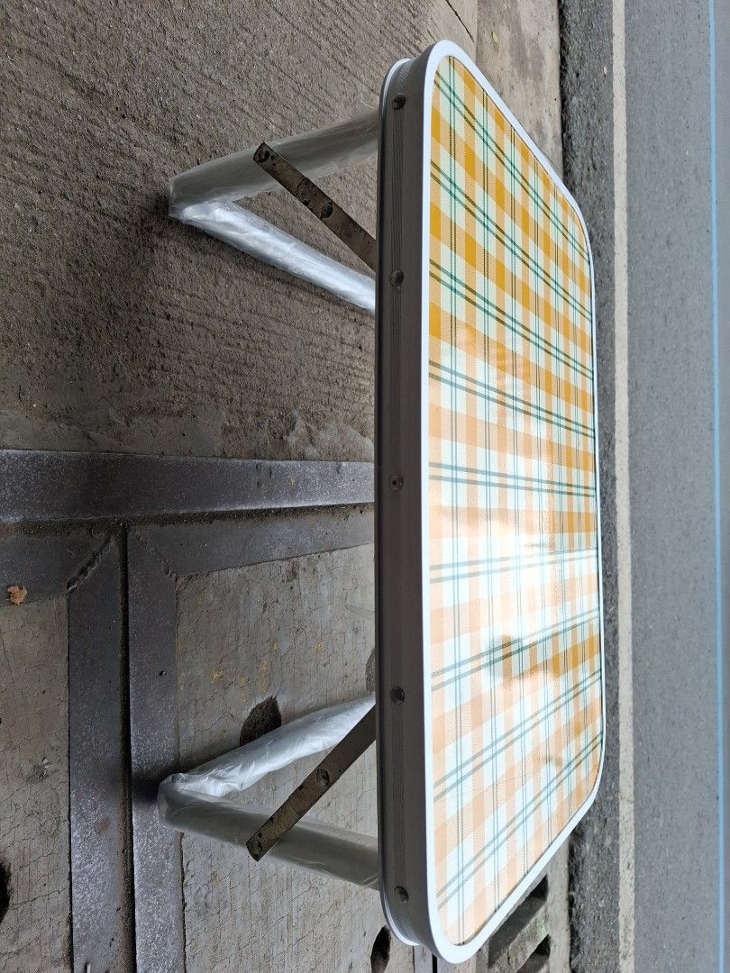 Field Village Folding Table - Portable Picnic Table (Category: Tables & Sets) located in Manila. Submitted by rocksolid227 (Listing ID 1462710598, Image 2). Description: - Portable folding table from Field Village - Ideal for picnics, camping, or as a lap desk - Features a yellow and white checkered pattern top - Legs fold flat for convenient storage and transport - Lightweight and easy to carry - Versatile for outdoor activities or extra indoor 