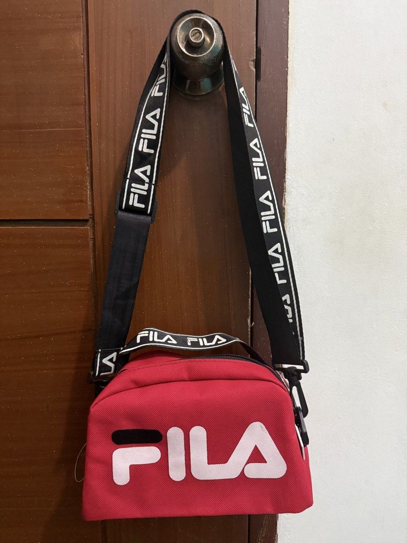 FILA Bag (Category: Cross-body Bags) located in Pasig City. Submitted by simply.trish (Listing ID 1462818686, Image 1). Description: Original FILA brandnew Color: Red Type: Sling Bag.