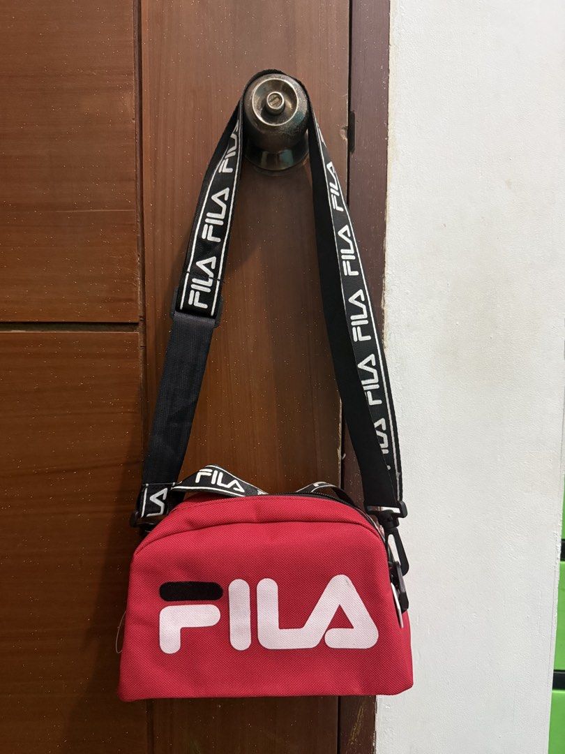 FILA Bag (Category: Cross-body Bags) located in Pasig City. Submitted by simply.trish (Listing ID 1462818686, Image 2). Description: Original FILA brandnew Color: Red Type: Sling Bag.