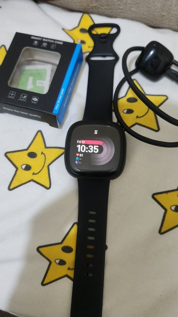Fitbit versa 4 (Category: Wearables & Smart Watches) located in Quezon City. Submitted by nujazupardo (Listing ID 1462771318, Image 1). Description: - Fitbit Versa 4 Smartwatch (Color: Black) - Original Charger Included - with Smartwatch Case - Screen Protector - new battery - Adjustable Watch Band - Ready for a New Owner -92% overall physical appearance .