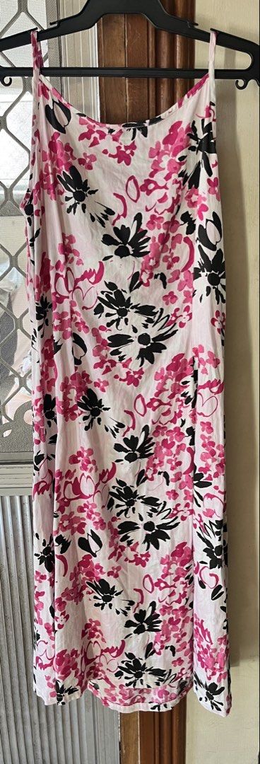 Floral dress (Category: Dresses) located in Bacoor. Submitted by ayit. (Listing ID 1462712661, Image 2). Description: - Chic white midi dress - Eye-catching pink and black floral print - Delicate spaghetti straps - Ideal for summer wear - Great for casual outings and beach days Small-med fit.