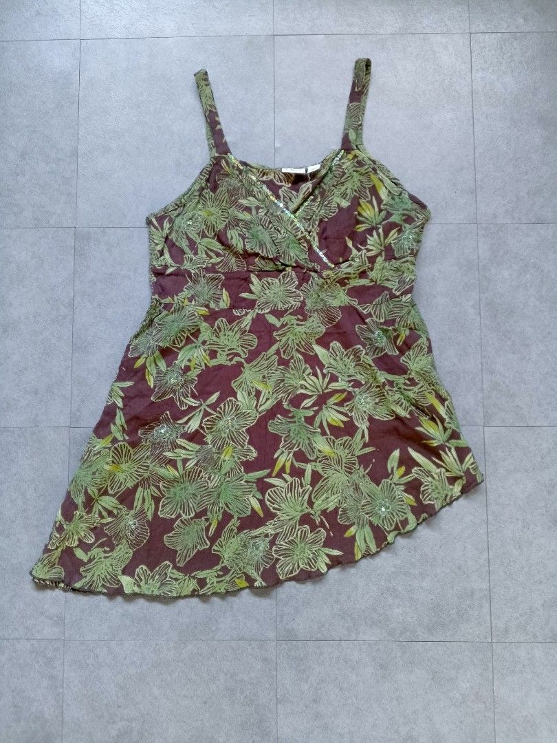 Floral Print Camisole Top with Sequins (Category: Sleeveless) located in Manila. Submitted by pescadorvi14235 (Listing ID 1462863592, Image 1). Description: - Brown camisole top - Green floral print with scattered sequins - Thin straps - Wrap-style front Excellent Condition 💯 Color Rate:9.8/10 Issue:🚫 Dimes:19x24.