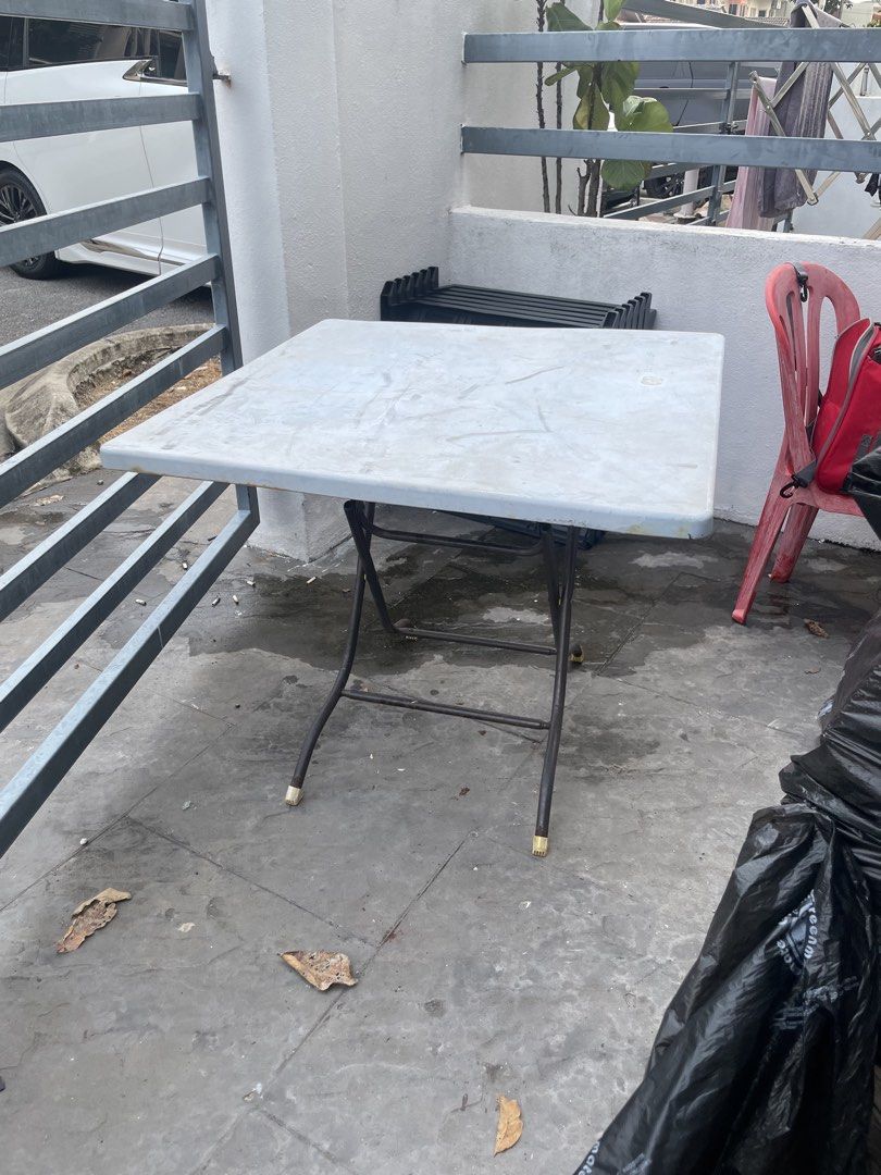 Foldable Plastic Table (Category: Tables & Sets) located in Shah Alam. Submitted by Goldenclans20 (Listing ID 1462822389, Image 2). Description: - Versatile foldable plastic table - Great for outdoor use, picnics, and events - Provides extra table space when needed - Surface has visible scratches and marks from previous use - Sturdy legs ensure stability - Folds up easily for convenient storage.