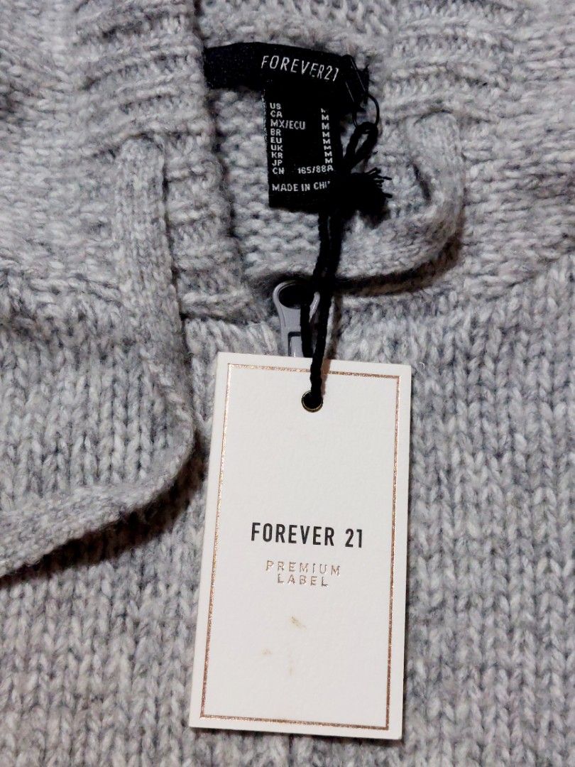 FOREVER 21 HOODED KNIT JACKET (Category: Coats, Jackets and Outerwear) located in Muntinlupa City. Submitted by japanaholicscollectibles (Listing ID 1462796633, Image 2). Description: DESCRIPTION : - Color : grey - Size : M CONDITION : - Authentic/original - Never used - Still with tag - Fits ladies M to XL.
