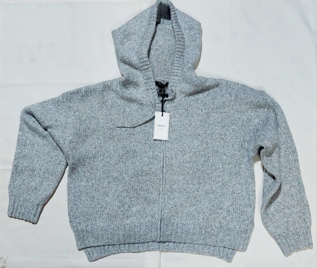 FOREVER 21 HOODED KNIT JACKET (Category: Coats, Jackets and Outerwear) located in Muntinlupa City. Submitted by japanaholicscollectibles (Listing ID 1462796633, Image 1). Description: DESCRIPTION : - Color : grey - Size : M CONDITION : - Authentic/original - Never used - Still with tag - Fits ladies M to XL.