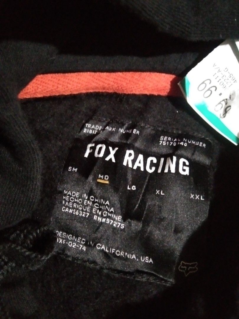 Fox Racing Black Hoodie (Category: Hoodies) located in Quezon City. Submitted by aljonbermu25659 (Listing ID 1462713273, Image 2). Description: - Black Fox Racing Hoodie - Size: Medium (MD) - Iconic Fox head logo with pink and gold outline - Designed in California, Made in China - Ideal for casual wear.