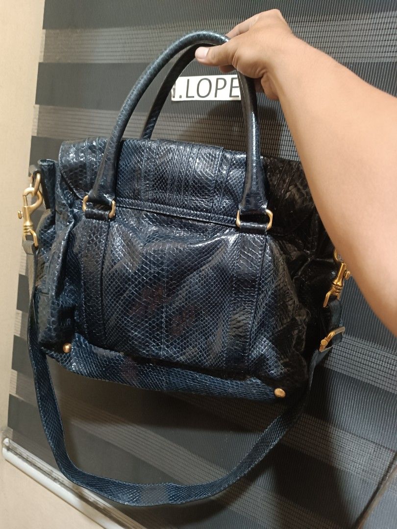 FS:Escada Navy Blue Python Leather Handbag (Category: Luxury Bags & Wallets) located in Manila. Submitted by ibmzepol91735 (Listing ID 1462869025, Image 2). Description: - Authentic Escada handbag - Material: Navy blue python leather - Origin: Made in Italy - Hardware: Gold-tone turn-lock closure - Features: Detachable shoulder strap, interior zippered pocket - Style: Unique texture, classic design - Versatile: Suitable for everyday use or specia