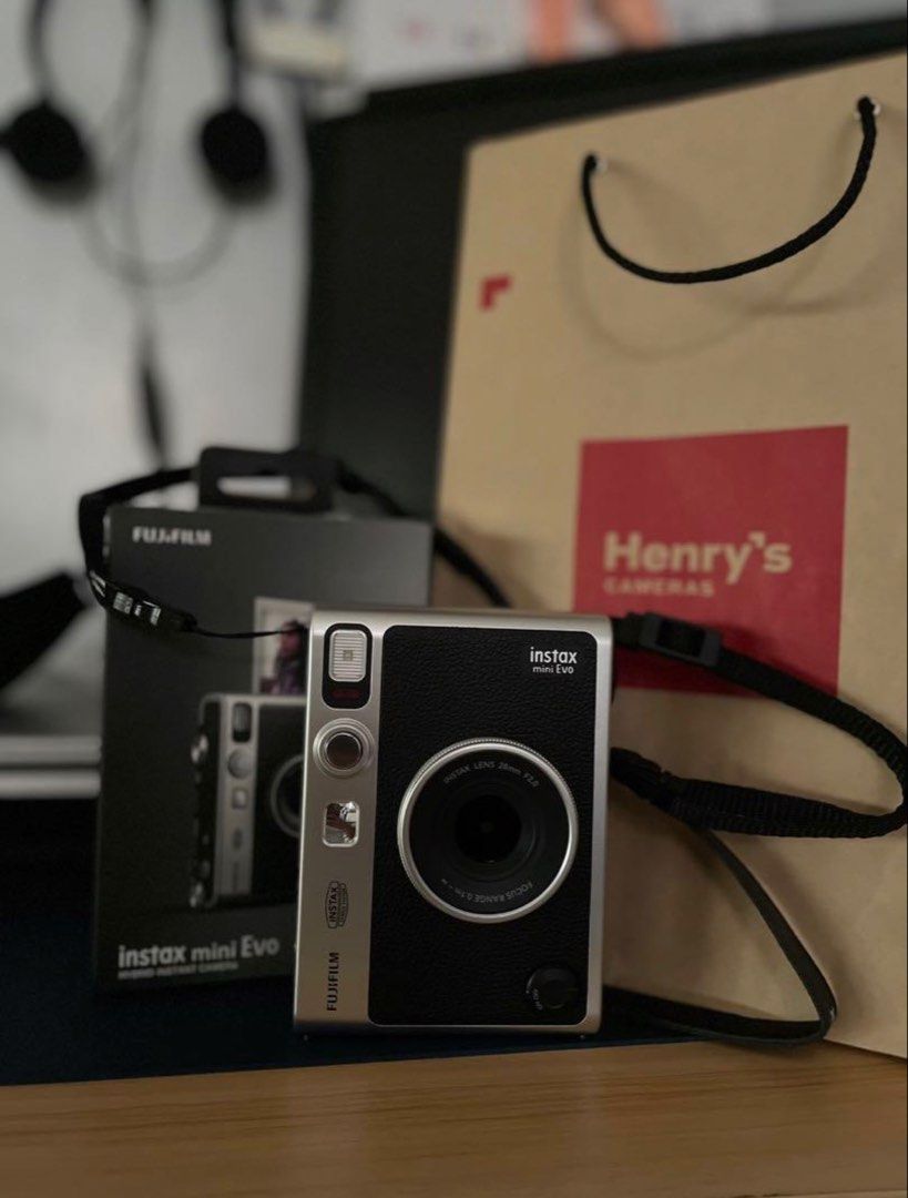 Fujifilm Instax Mini Evo Hybrid Instant Camera (Category: Cameras) located in Manila. Submitted by declutteross (Listing ID 1462875811, Image 1). Description: - Fujifilm Instax Mini Evo hybrid instant camera - Color: Black - Includes original strap - Comes with original USB charging cable - Ideal for both instant photos and digital prints - User-friendly controls on the back - Ready for your next event! - No issues or history of repair ‼️PRICE ST