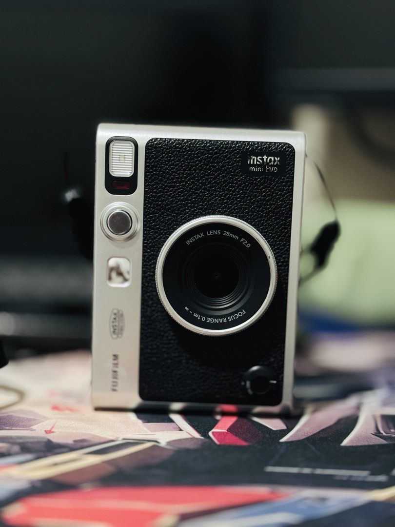 Fujifilm Instax Mini Evo Hybrid Instant Camera (Category: Cameras) located in Manila. Submitted by declutteross (Listing ID 1462875811, Image 3). Description: - Fujifilm Instax Mini Evo hybrid instant camera - Color: Black - Includes original strap - Comes with original USB charging cable - Ideal for both instant photos and digital prints - User-friendly controls on the back - Ready for your next event! - No issues or history of repair ‼️PRICE ST