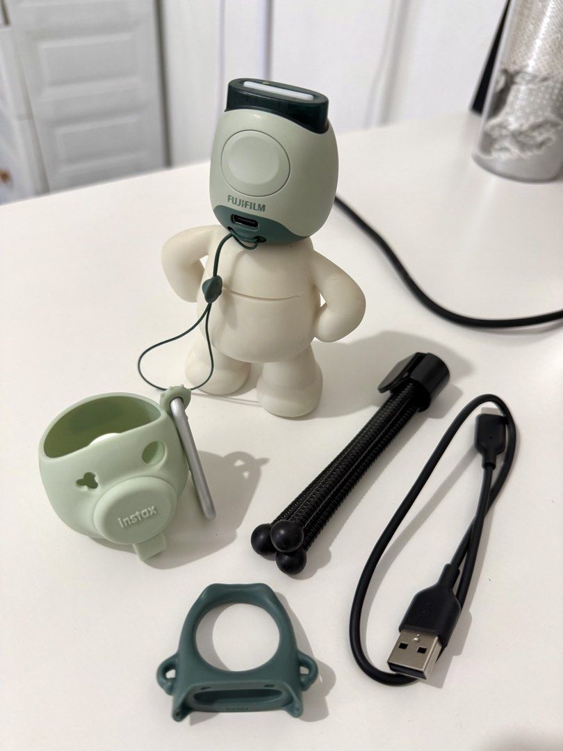 Fujifilm Instax Pal with Accessories (Category: Cameras) located in Caloocan City. Submitted by jhanamarie (Listing ID 1462818385, Image 2). Description: Hello, selling my cutie instax Pal in Pistachio Green, perfect for capturing candid moments and bringing it anywhere! 📷 Condition: Well-kept & fully functional, hindi ko lang talaga nagagamit since I have instax mini cameras. Inclusions: Original silicone case Mini tripod Multi-use detachable r