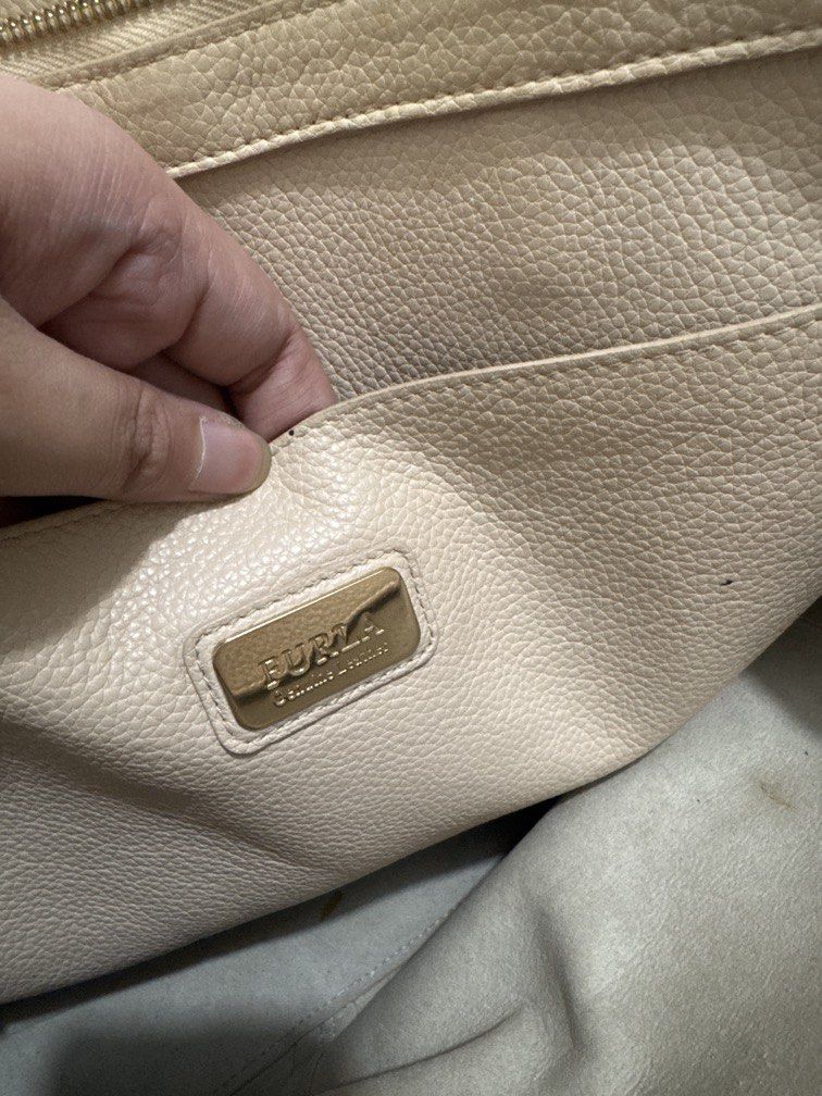 Furla Beige Shoulder Bag (Category: Shoulder Bags) located in Mexico. Submitted by studioleraph (Listing ID 1462722417, Image 3). Description: 🏷️ Brand: Furla 👜 The actual item being sold is the original bag shown in the product photos. Small differences in color, texture, or details may occur. 💌 Condition: • Preloved; Have flaws • Please manage expectations as these are vintage/pre-owned pieces. • Colors may vary slightly due to lighting and 