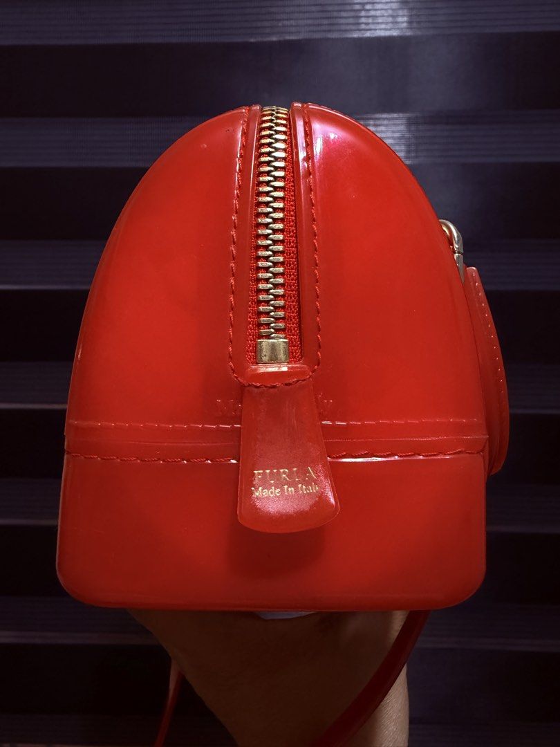 Furla Candy Mini Boston Bag Red Jelly (Category: Luxury Bags & Wallets) located in Tarlac. Submitted by rizasdeclutteringonline (Listing ID 1462857207, Image 3). Description: - Adorable red Furla mini Boston bag - Made from durable jelly material - Comes with comfortable top handles - Includes a detachable shoulder strap for versatile carrying - Secure zipper closure - Compact size, ideal for carrying your essentials - Authentically Made in Italy