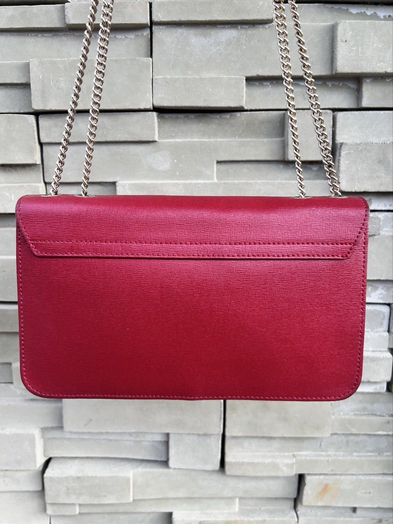 Furla Red Leather Chain Convertible Bag (Category: Luxury Bags & Wallets) located in San Jose. Submitted by jorelleah (Listing ID 1462810746, Image 3). Description: - Classic Furla Metropolis red leather convertible - Features a gold-tone clasp closure with Furla logo - Stylish chain strap detail - Ideal for evening events or adding a pop of color - Can fit long wallet.