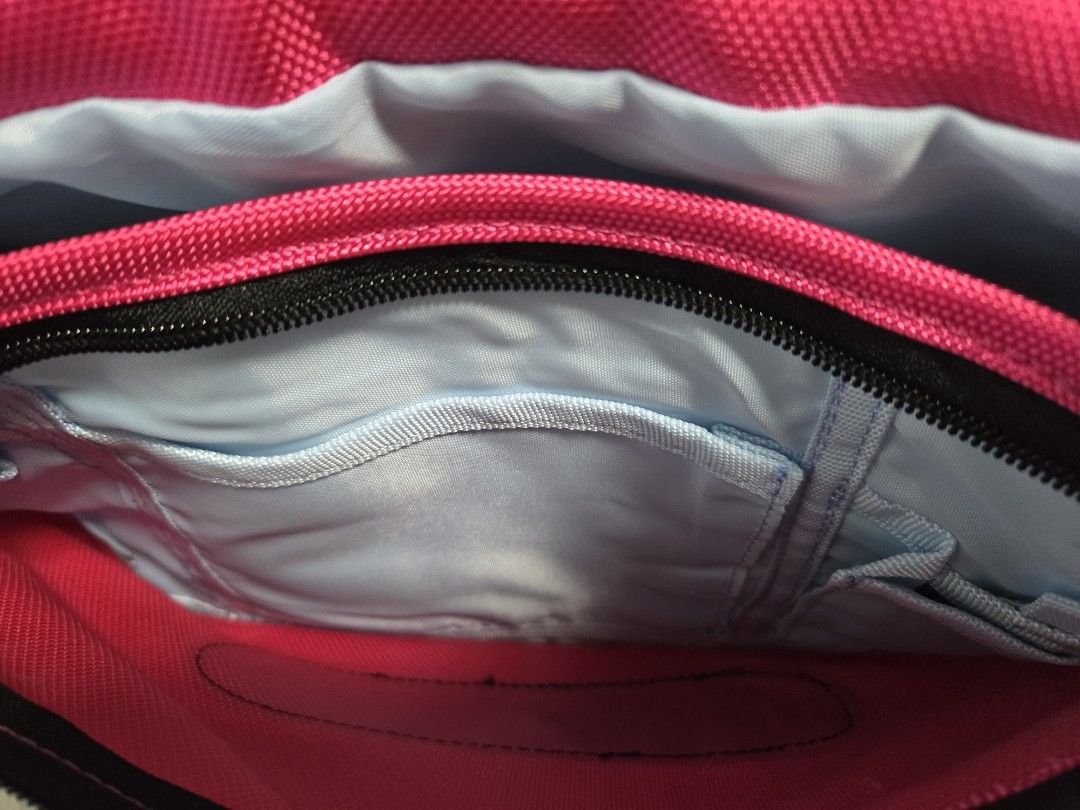 Gadget Camera Sling Bag (Category: Cross-body Bags) located in Manila. Submitted by luxtimeless (Listing ID 1462796218, Image 3). Description: - Bright pink TRUC sling bag - Main compartment with internal pockets - Adjustable strap - Perfect for everyday use or travel - Clean inside and out.