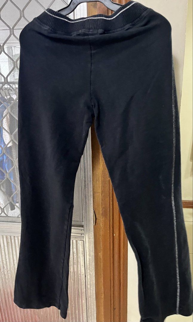 Garterized pants (Category: Other Bottoms) located in Bacoor. Submitted by ayit. (Listing ID 1462782325, Image 2). Description: - Garterized black pants - Size: Medium (fits EU 38/UK 10/US 26) - Comfortable waistband with white stripe detail - Subtle white stripe along side seams - Cute star accent on front left - Ideal for casual wear and lounging - Meetup location: Citta Italia Subdivision, Bacoor, Cavite.