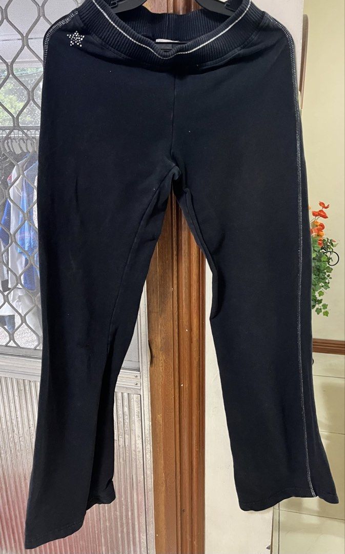Garterized pants (Category: Other Bottoms) located in Bacoor. Submitted by ayit. (Listing ID 1462782325, Image 1). Description: - Garterized black pants - Size: Medium (fits EU 38/UK 10/US 26) - Comfortable waistband with white stripe detail - Subtle white stripe along side seams - Cute star accent on front left - Ideal for casual wear and lounging - Meetup location: Citta Italia Subdivision, Bacoor, Cavite.