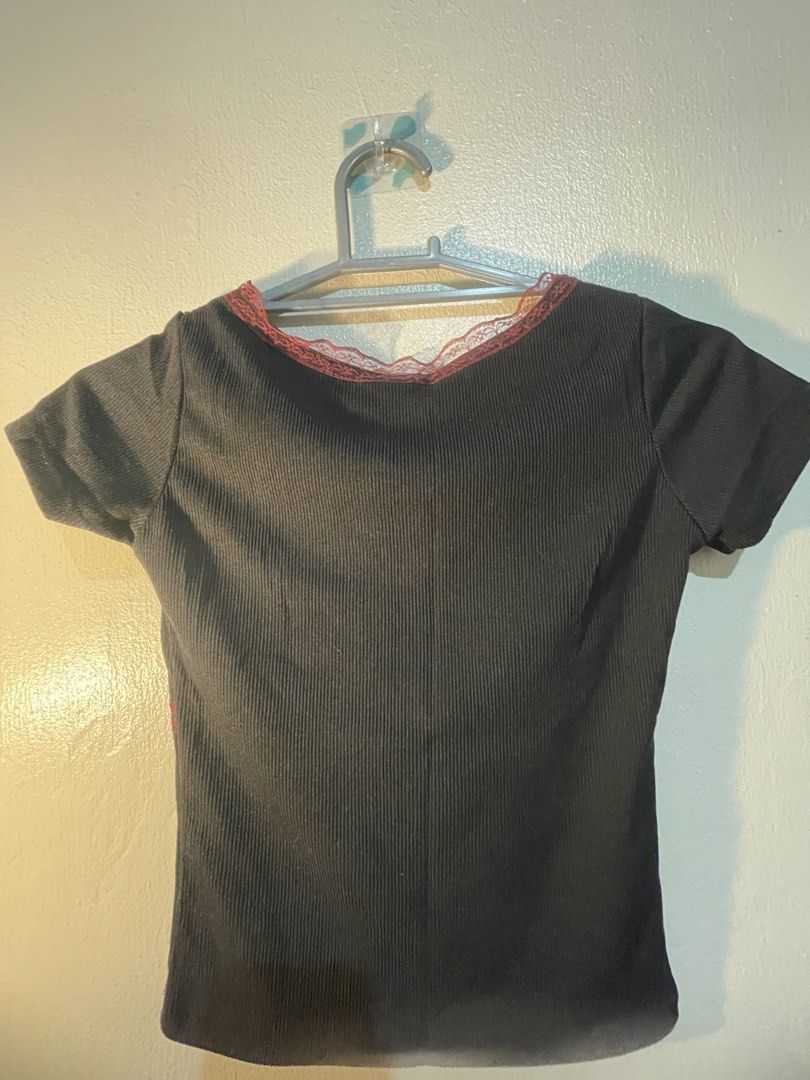 Girl Code Black Ribbed Lace Trim V-Neck Top Size Small (Category: Shirts) located in Manila. Submitted by sammmm777 (Listing ID 1462814864, Image 1). Description: - Brand: Girl Code - Color: Black - Material: Ribbed, stretchy - Neckline: V-neck - Details: Red lace trim on V-neck and crossing over bust - Sleeves: Short - Style: Versatile for casual or dressed-up looks.