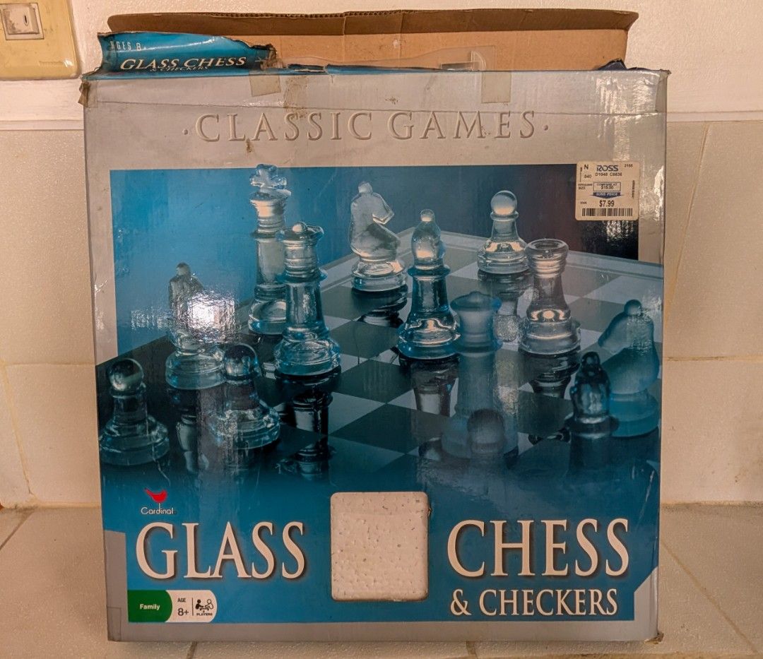 Glass Chess and Checkers (Category: Board Games & Puzzles) located in Manila. Submitted by kikopabilla (Listing ID 1462699423, Image 1). Description: A classic glass board game set, including complete pieces for both chess and checkers, is securely packaged in a box with styrofoam for protection..