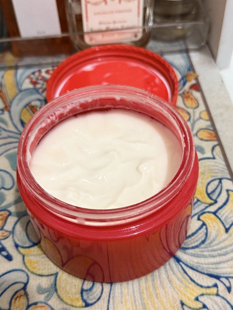 Glossier You (Category: Body Care) located in Manila. Submitted by scents_and_scentsibility (Listing ID 1462854588, Image 2). Description: - Thick and creamy body moisturizer - Comes in a red jar with a red lid - Leaves skin feeling hydrated and smooth - Generous amount of product remaining.