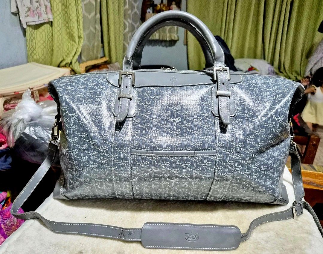 Goyard Grey Monogram Duffel / Boston Bag (Category: Baby Monitors) located in Mandaue City. Submitted by chuchi152615 (Listing ID 1462740235, Image 2). Description: - Grey Goyard duffel bag - Iconic Goyardine canvas with classic monogram - Genuine leather handles and adjustable strap - Convenient front pocket for easy access - Shows some wear on the strap, as pictured - Ideal for weekend getaways or gym sessions.