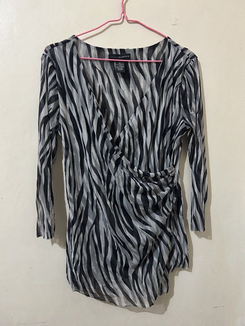 Grace Elements Zebra Print Sheer Long Sleeve Wrap Top (Category: Blouses) located in Naga. Submitted by aroaldaw (Listing ID 1462795707, Image 1). Description: - Sheer long sleeve top - Trendy zebra print - Flattering wrap style with side ruching - Made from 100% polyamide - Versatile for layering or wearing solo - Size L.