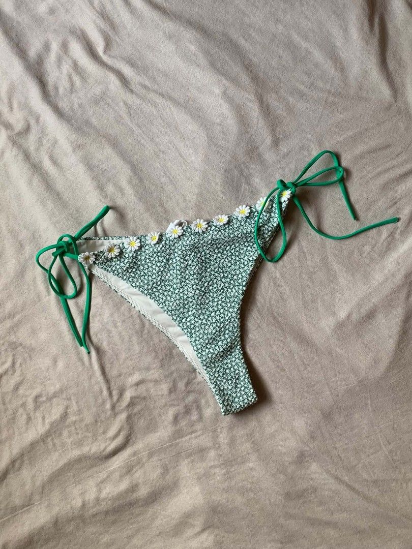 Green floral bikini bottoms (Category: Bikinis & Swimsuits) located in Cebu City. Submitted by book_bird (Listing ID 1462763523, Image 1). Description: - Cute green bikini bottoms - Tiny floral print - Daisy appliques along the top edge - Adjustable green side ties - Perfect for beach or pool.