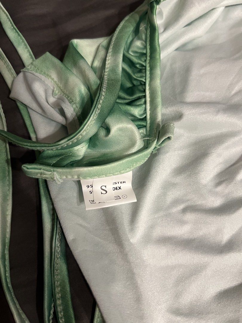 Green Tie-Dye Halter Neck Crop Top (Category: Sleeveless) located in Paranaque City. Submitted by dubaichocolei (Listing ID 1462741166, Image 3). Description: - Cute green tie-dye halter neck crop top - Silky material - Adjustable tie straps at the back and sides - Versatile for going out or casual wear - Size S.