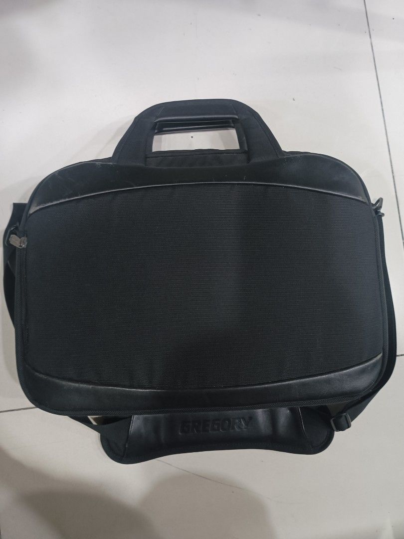 Gregory Black Laptop Bag with Shoulder Strap (Category: Laptop Bags & Sleeves) located in Quezon City. Submitted by arvietekto (Listing ID 1462682871, Image 3). Description: Gregory Laptop bag/briefcase - Brand: Gregory - Type: Laptop Bag - Features: Padded shoulder strap for comfort, multiple zippers for easy access - Design: Visible Gregory logo on strap and zippers - Capacity: Plenty of space for laptop and accessories - Use: Great for work or