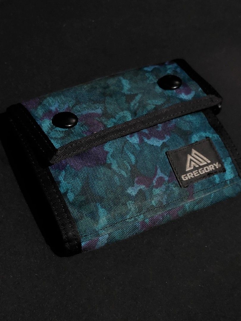 Gregory Tri-Fold Wallet Floral Pattern (Category: Wallets & Card holders) located in Pozorrubio. Submitted by aquidafinds (Listing ID 1462815719, Image 1). Description: - Gregory tri-fold wallet - Stylish teal and purple floral print - Exterior zippered coin pocket - Multiple interior card slots - Bill compartment - Durable material - Ideal for everyday use.