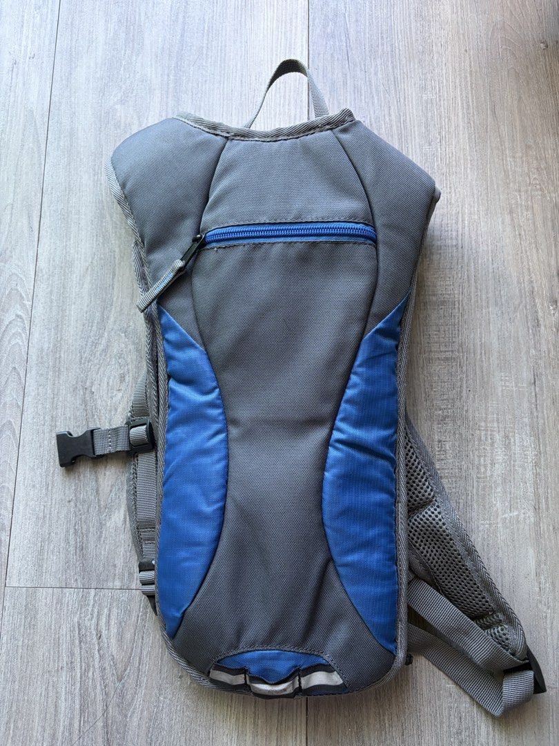 Grey and Blue Hydration Backpack for Cycling or Hiking (Category: Backpacks) located in Muntinlupa City. Submitted by bentaboi (Listing ID 1462726626, Image 2). Description: - Grey and blue hydration backpack - Breathable mesh back panel for comfort - Adjustable straps for a perfect fit -no bladder (not included) - Ideal for outdoor activities like cycling and hiking - Plenty of storage for your essentials.