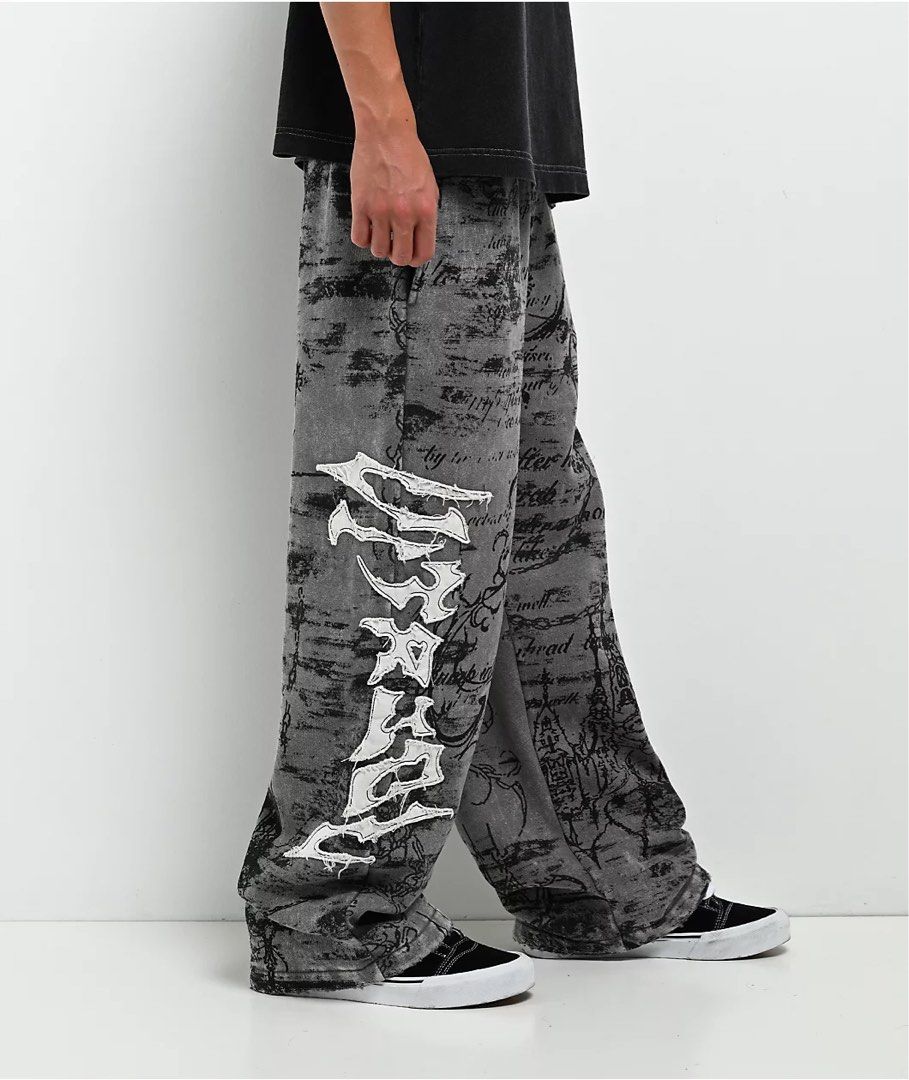 Grey Graphic Print Distressed Sweatpants (Category: Other Bottoms) located in Cabuyao City. Submitted by 0ld_souls (Listing ID 1462866609, Image 3). Description: - Grey sweatpants with all-over graphic print - Distressed details and ripped accents on the sides - Comfortable elastic waistband - Loose, streetwear-inspired fit - Perfect for casual wear.