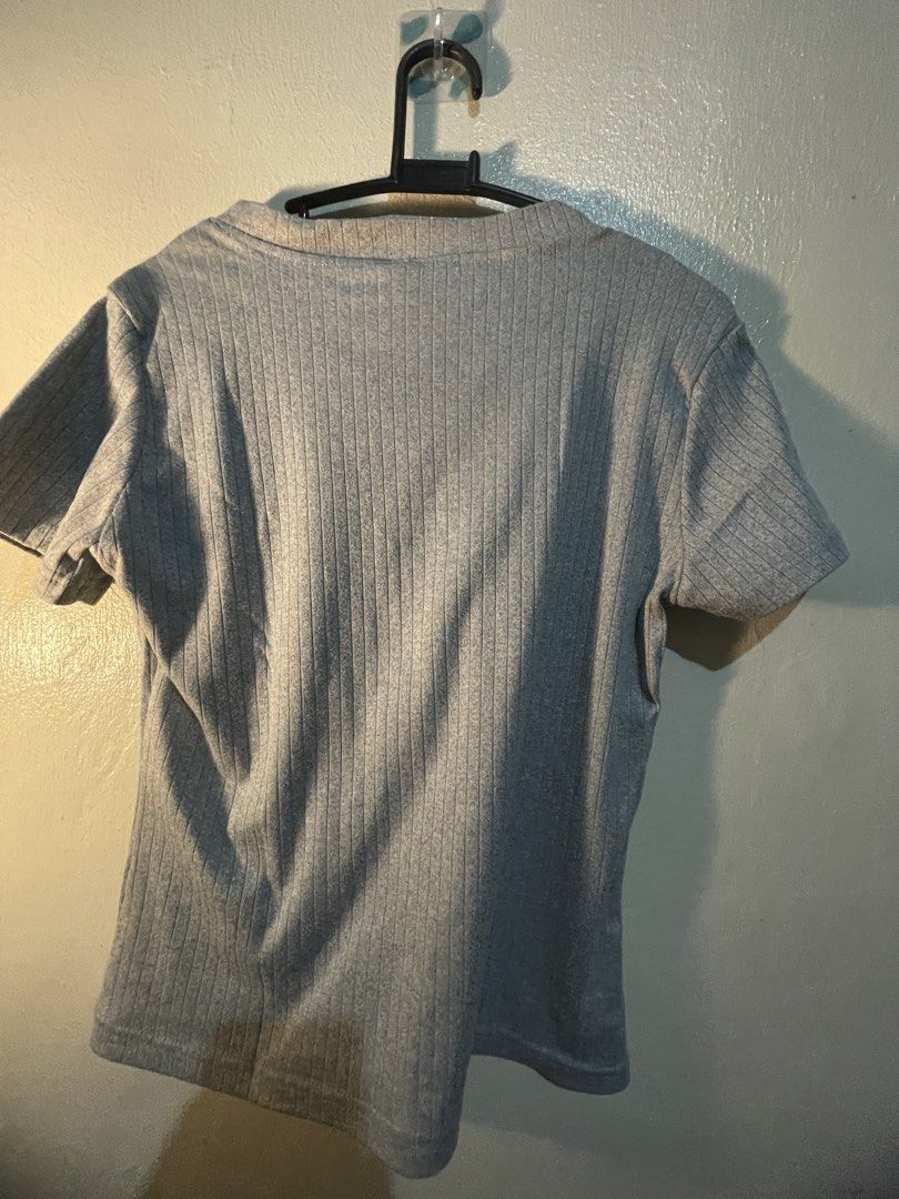 Grey Ribbed Short Sleeve T-Shirt (Category: Shirts) located in Manila. Submitted by sammmm777 (Listing ID 1462815396, Image 2). Description: - Grey t-shirt with a ribbed texture - Short sleeves and crew neck - Stretchy fabric for comfort ( cotton) - same frabric from mafie -( from tiktok shop ).