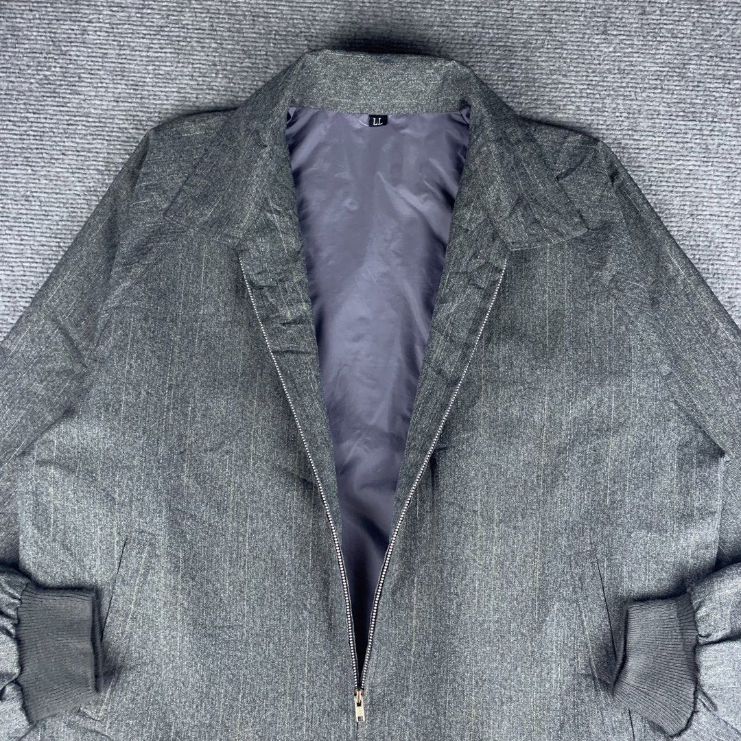 Grey Striped Collared Zip up Jacket (Category: Coats, Jackets and Outerwear) located in Baguio. Submitted by vintage_lurker (Listing ID 1462853747, Image 3). Description: Size on tag: Large Width: 24” Length: 28” Issue/s: none Mine: 550 + Shipping fee 📍Payment first policy. no COD or COP 📍All items Washed and Sanitized 🧼 Shoot your offer. I’m all ears‼️ OTHER DETAILS: - Stylish grey jacket with subtle vertical stripes. - Features a convenient 