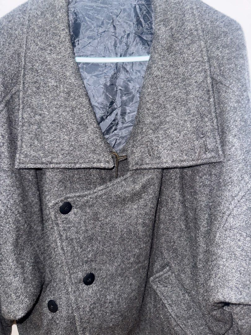 Grey Wool Double Breasted Coat (Category: Coats, Jackets and Outerwear) located in Manila. Submitted by quintessesommerset (Listing ID 1462874041, Image 3). Description: - Cool grey coat, likely a wool blend. 23x27 - Stylish double-breasted design with black buttons. - Unique collar can be worn up or down. - Features two convenient front pockets. - Ideal for keeping warm in cooler weather..