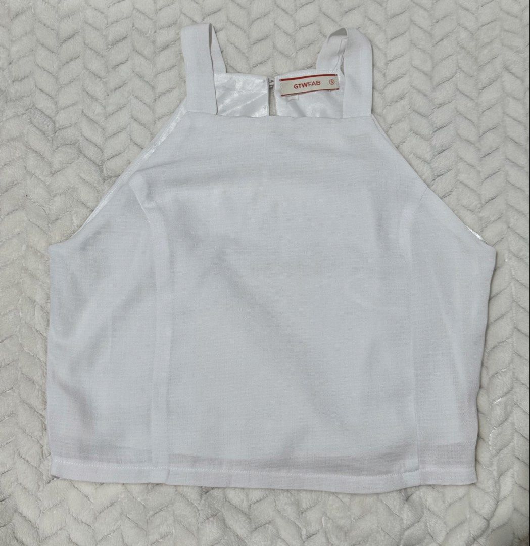 GTWFAB White Square Neck Cropped Tank Top Size S (Category: Sleeveless) located in Manila. Submitted by gmaaeee (Listing ID 1462862584, Image 2). Description: - White cropped tank top from GTWFAB - Square neckline - Thick straps - Zipper closure at the back - Simple and versatile design, perfect for any outfit - Suitable for casual outings or dressing up.