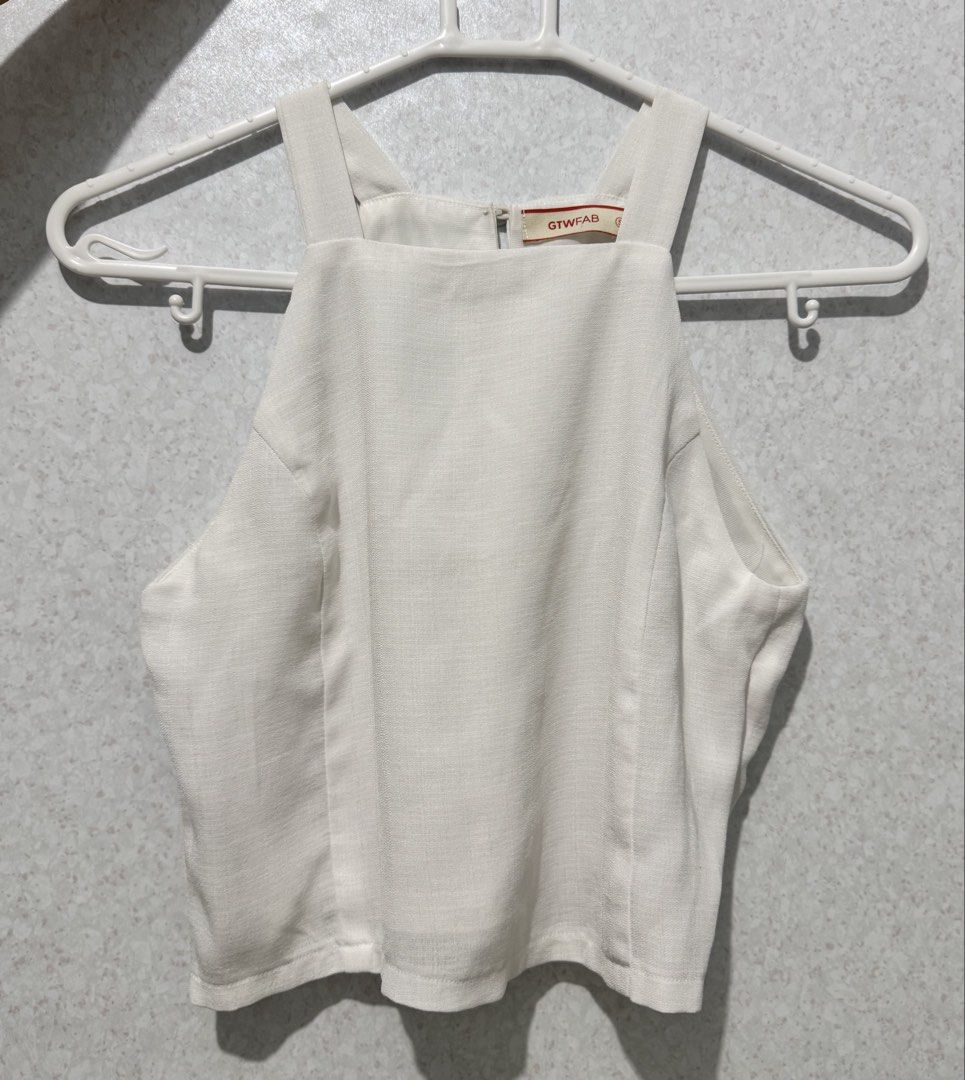 GTWFAB White Square Neck Cropped Tank Top Size S (Category: Sleeveless) located in Manila. Submitted by gmaaeee (Listing ID 1462862584, Image 1). Description: - White cropped tank top from GTWFAB - Square neckline - Thick straps - Zipper closure at the back - Simple and versatile design, perfect for any outfit - Suitable for casual outings or dressing up.