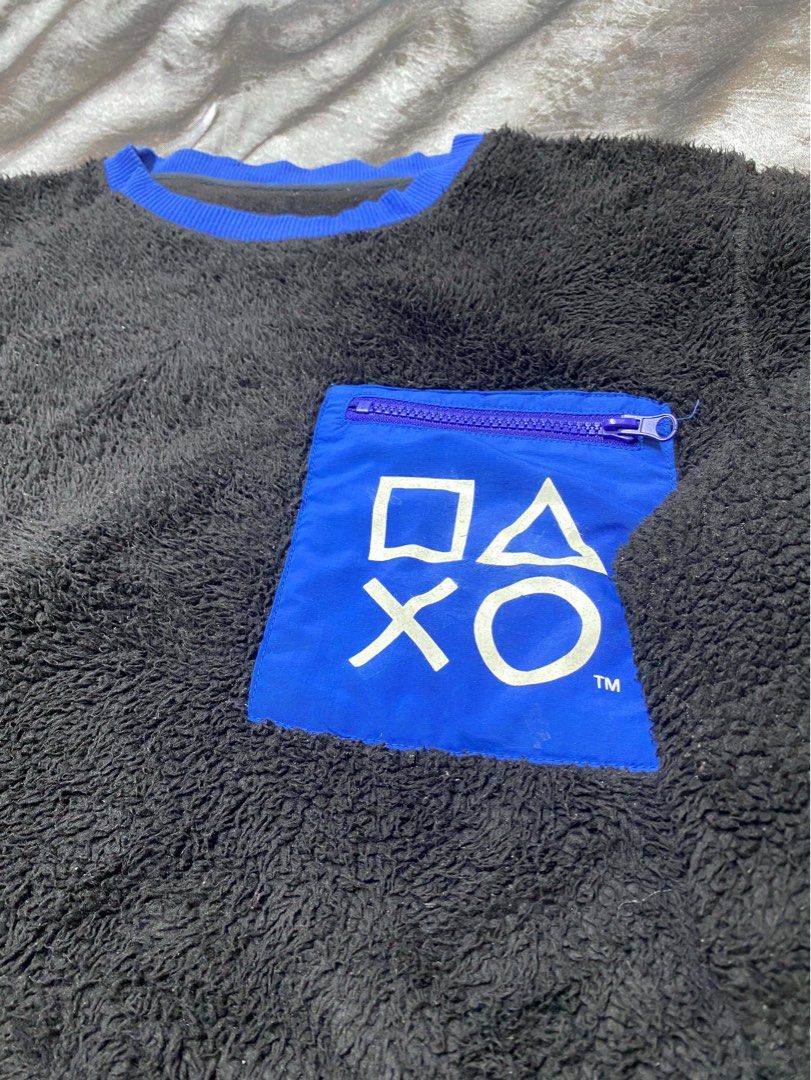 GU PlayStation Fleece Pullover Sweatshirt (Category: Coats, Jackets and Outerwear) located in Cavite. Submitted by bellewii (Listing ID 1462847035, Image 2). Description: - Black GU fleece pullover - PlayStation branding - Blue zippered chest pocket with PlayStation symbols - Embroidered PlayStation logo and text on right sleeve - Blue trim on collar, cuffs, and hem - Super cozy material.
