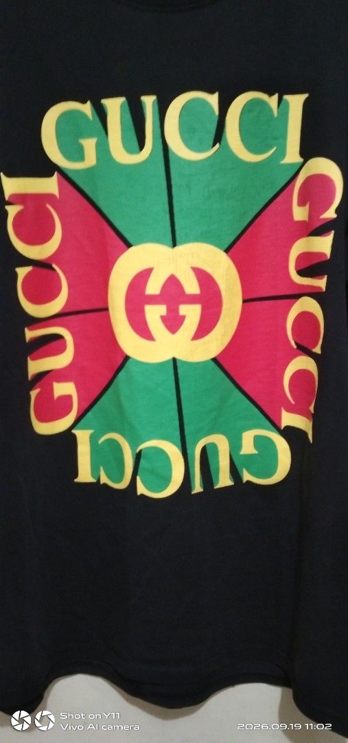 Gucci big logo t-shirt (Category: Tshirts & Polo Shirts ) located in Quezon City. Submitted by okeykathrift (Listing ID 1462705914, Image 2). Description: Gucci big logo t-shirt Made in Italy Size: XS oversized (Fits medium to large) Dimensions: 27 in (length from shoulder to waist) / 20 in (body width) Issues: No neck tag. Loose stitching at the bottom of t-shirt and at the back of left sleeve. Not noticeable from a distance. Hairline cracks on 