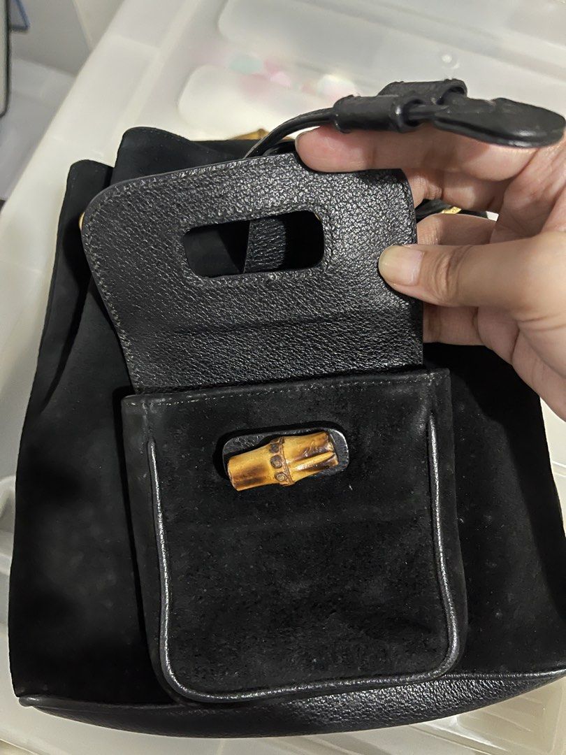 Gucci Black Suede Bamboo Handle Backpack (Category: Backpacks) located in Paranaque City. Submitted by alexagamboa (Listing ID 1462826161, Image 3). Description: - Luxurious black suede backpack - Elegant leather trim - Unique bamboo handle - Front pocket with bamboo detail - Secure drawstring closure - Interior zippered pocket - Crafted in Italy - Stylish gold hardware.
