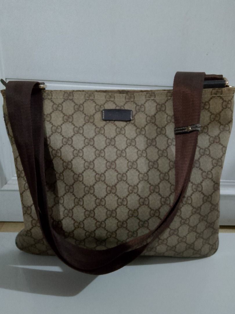 Gucci GG Supreme Canvas Messenger Bag (Category: Luxury Bags & Wallets) located in Caloocan City. Submitted by luckyturtle.aa6ccf (Listing ID 1462707238, Image 3). Description: - Authentic Gucci messenger bag - Classic GG Supreme canvas with brown leather trim - Adjustable strap for comfortable wear - Practical for everyday use - Shows some signs of wear consistent with use (please check photos for details).
