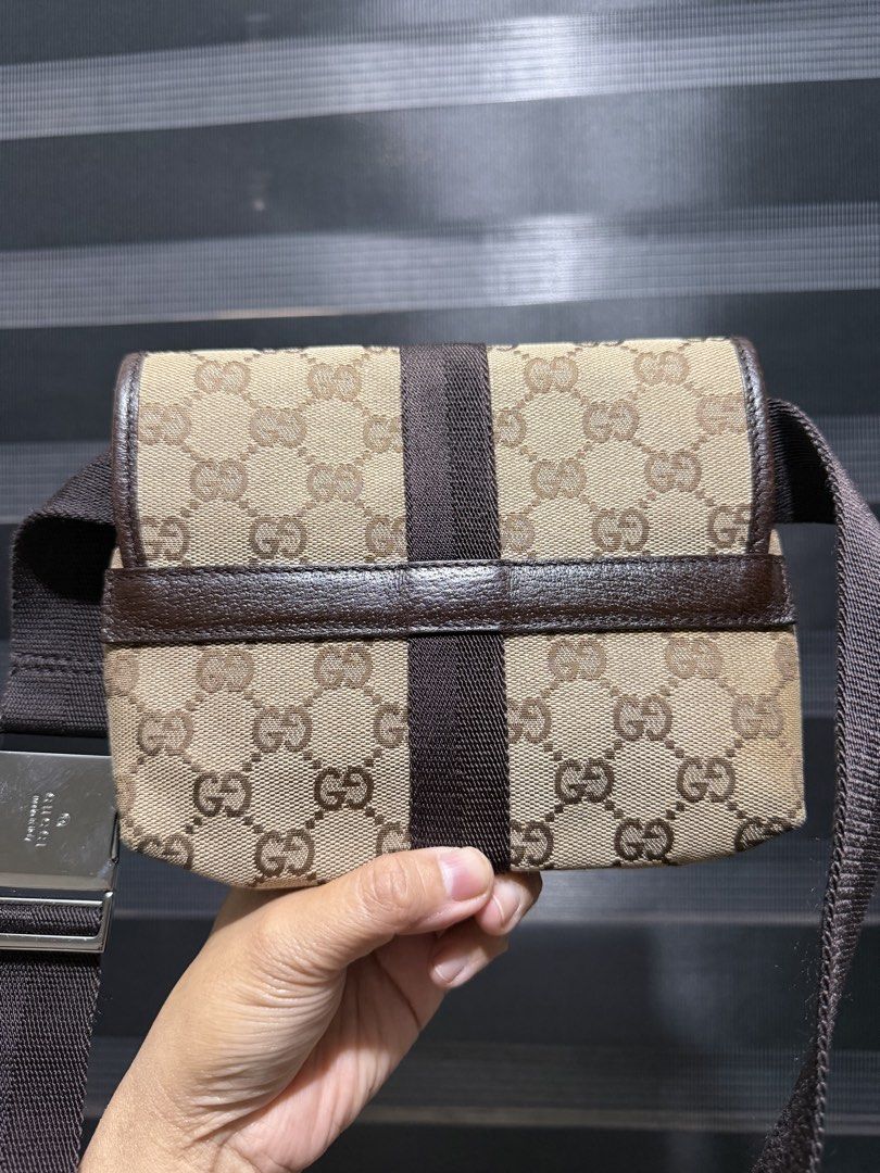 Gucci Monogram Canvas Waist Bag Belt Bag (Category: Luxury Bags & Wallets) located in Tarlac. Submitted by rizasdeclutteringonline (Listing ID 1462855821, Image 3). Description: - Authentic Gucci GG monogram canvas waist bag - Signature brown GG pattern - Adjustable dark brown strap with engraved Gucci logo buckle - Perfect for keeping essentials accessible - Made in Italy - good condition - no rubs sa mga side - no cracks also - kasya hanggang s