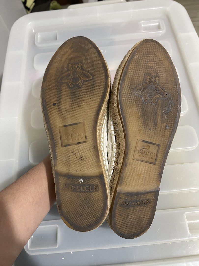 Gucci White Leather GG Marmont Espadrilles (Category: Flats & Sandals) located in Paranaque City. Submitted by alexagamboa (Listing ID 1462827262, Image 2). Description: - Authentic Gucci white leather espadrilles - Features iconic GG logo hardware - Classic jute sole detail - Made in Spain - Shows some signs of wear on insoles and soles - Perfect for stylish casual wear.