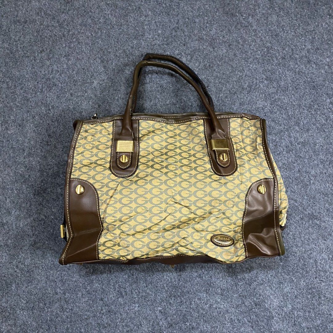 Guess Monogram Canvas & Leather Trim Tote Bag (Category: Tote Bags) located in Cebu City. Submitted by callmejasonx (Listing ID 1462802164, Image 1). Description: - Classic Guess tote bag - Signature 'G' monogram pattern on canvas - Brown leather trim accents - Gold-tone hardware - Spacious interior, perfect for everyday use - Stylish and practical accessory.