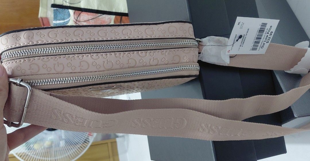 Guess Monogram Crossbody Bag Pink (Category: Cross-body Bags) located in Pasig City. Submitted by janalopez904 (Listing ID 1462864754, Image 3). Description: - Authentic Pink Guess crossbody bag - Features iconic all-over G logo pattern - Stylish silver Guess logo hardware - Secure zipper closure - Adjustable strap for comfortable wear - Comes with original tags - Ideal for everyday use and carrying your essentials.