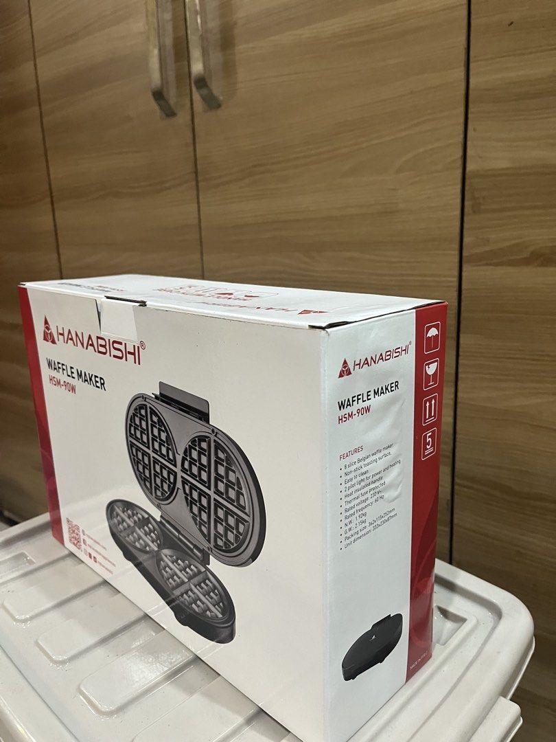 Hanabishi Waffle Maker HSM-90W (Category: Other Kitchen Appliances) located in Manila. Submitted by jericho_chan (Listing ID 1462723302, Image 2). Description: - Hanabishi Belgian Waffle Maker (Model: HSM-90W) - Perfect for making delicious Belgian waffles - Features a non-stick surface for easy food release - Simple to clean after use - Indicator lights for power and heating status - Rated Voltage: 230V - Rated Frequency: 60Hz - Net Weight: 1.2k