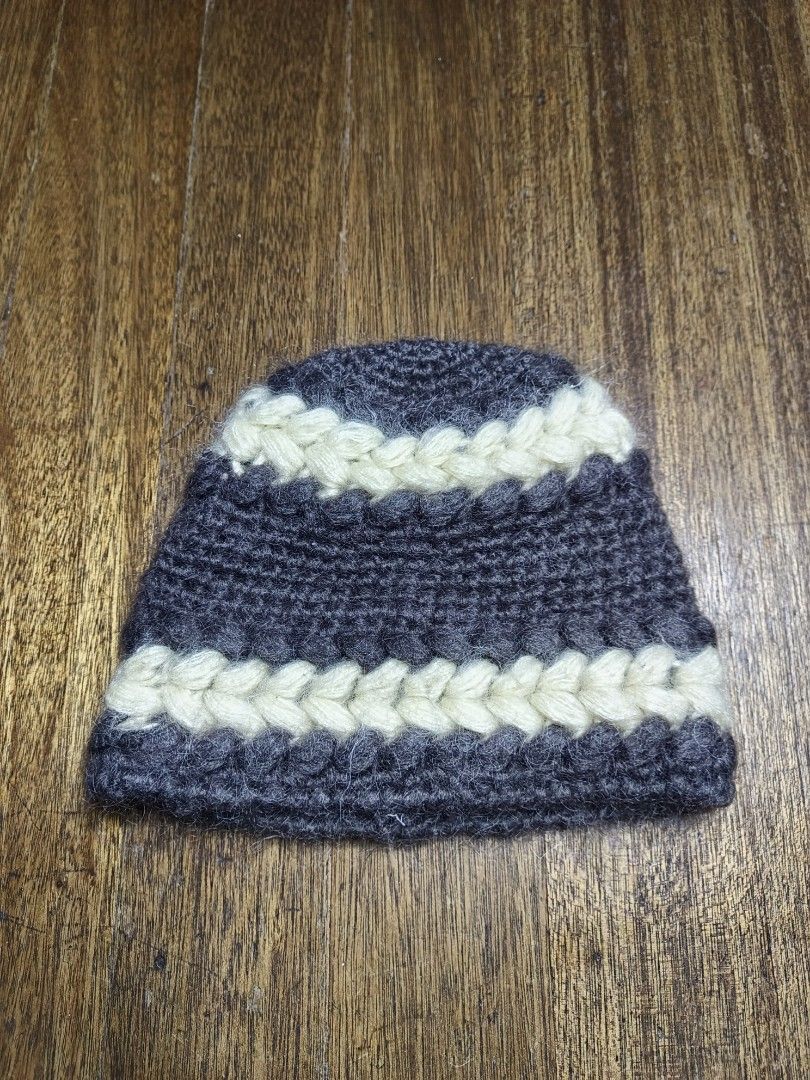 Handmade Knit Beanie Hat - Dark Grey & Cream (Category: Hats & Beanies) located in Mandaluyong City. Submitted by heatgear (Listing ID 1462834095, Image 1). Description: - Cozy knit beanie - Dark grey base with cream braided accents - Inner tag features Japanese writing - Ideal for keeping warm width 10 inches .