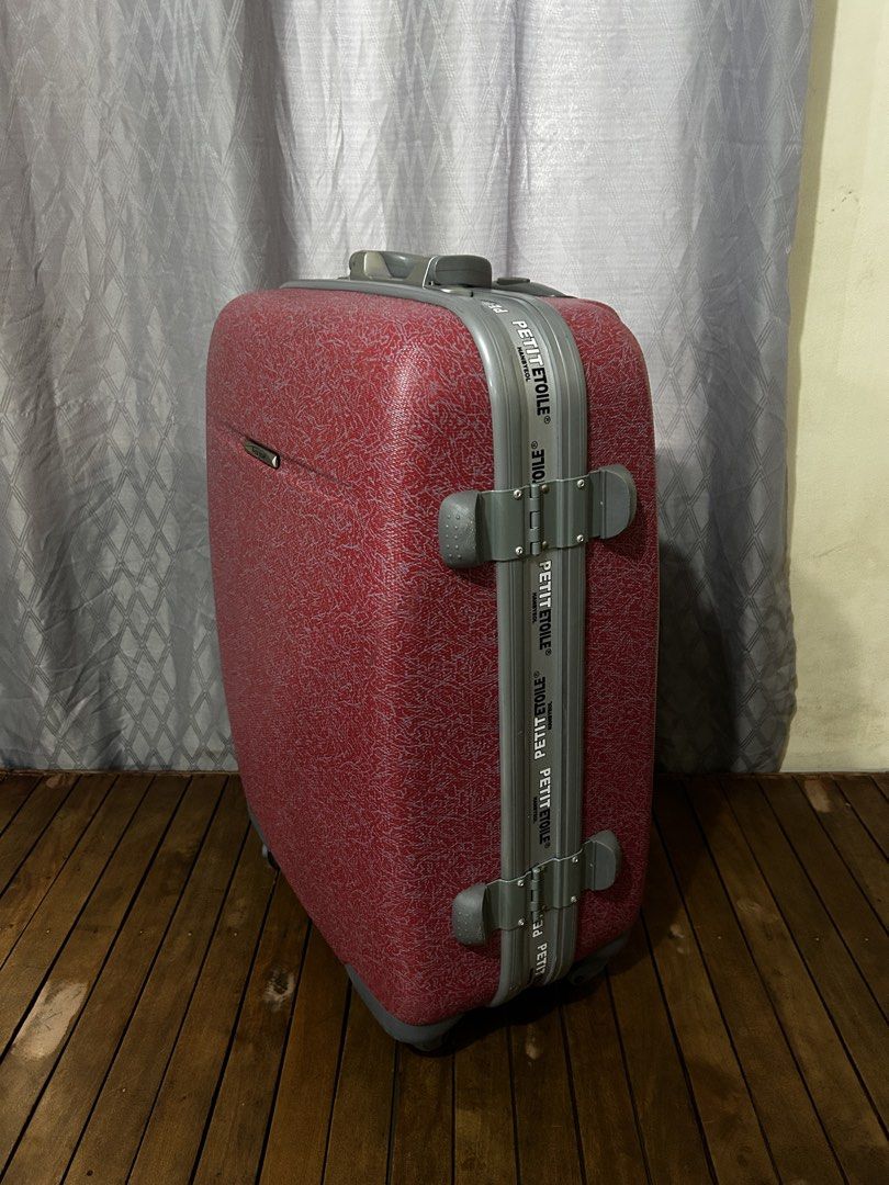 HB Petit Etoile Hard Shell Luggage (Category: Luggage) located in Taguig. Submitted by ghiebow06 (Listing ID 1462761153, Image 2). Description: Dimensions: H- 25 W- 16 1/2 D- 10 - Sturdy red hard shell with a subtle pattern - Easy to maneuver with retractable handle and wheels - Convenient side and top handles for carrying - Secure your belongings with the built-in combination lock with key - Ideal for all your travel needs.