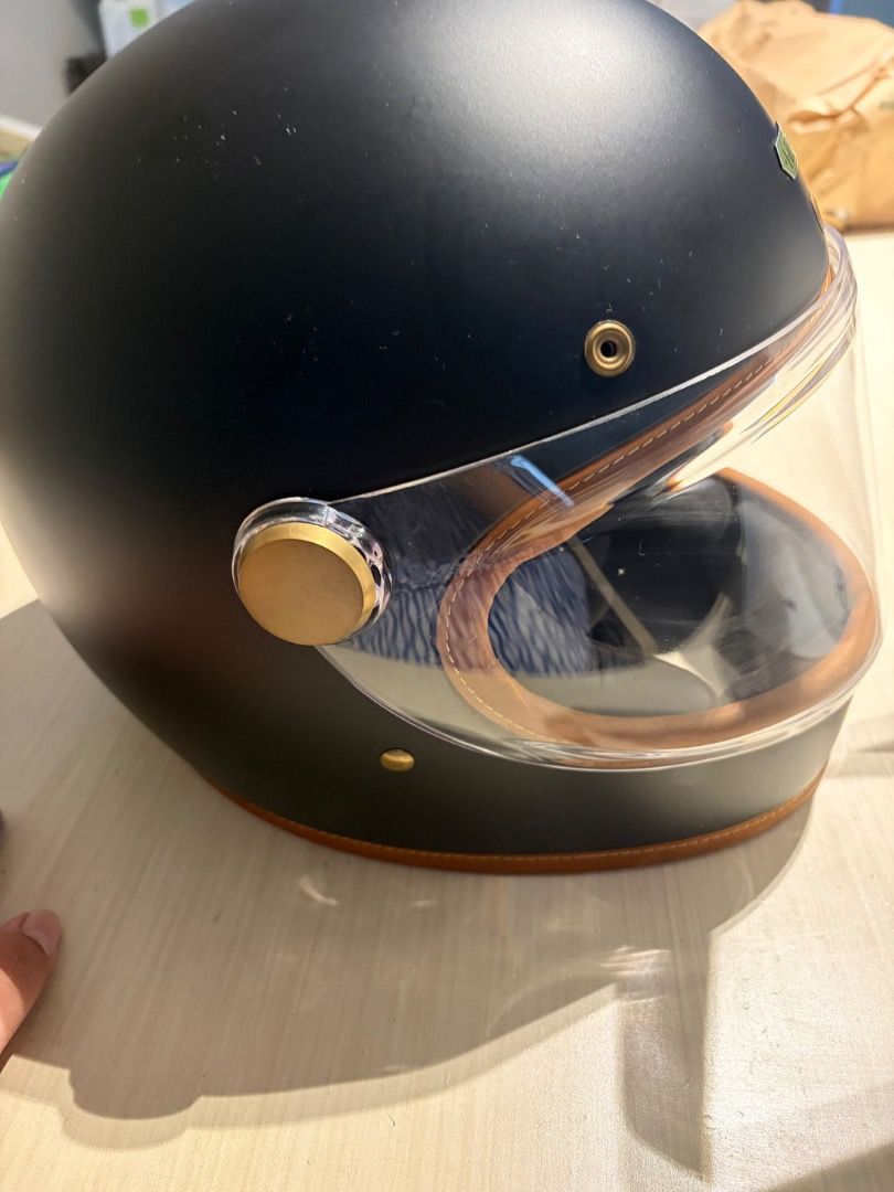 Hedon Hedonist Helmet - Matte Black (Category: Helmets and other Riding Gears) located in Caloocan City. Submitted by cg031 (Listing ID 1462788989, Image 2). Description: - Matte black Hedon helmet - Clear visor with brown leather trim - Gold hardware details - Stylish and retro design - Perfect for motorcycle rides.